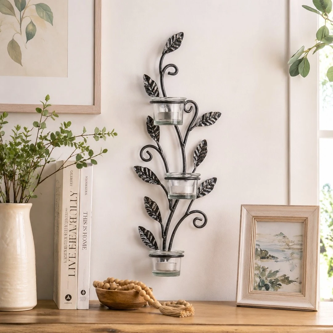 Aura black iron wall candlestick styled above a console table