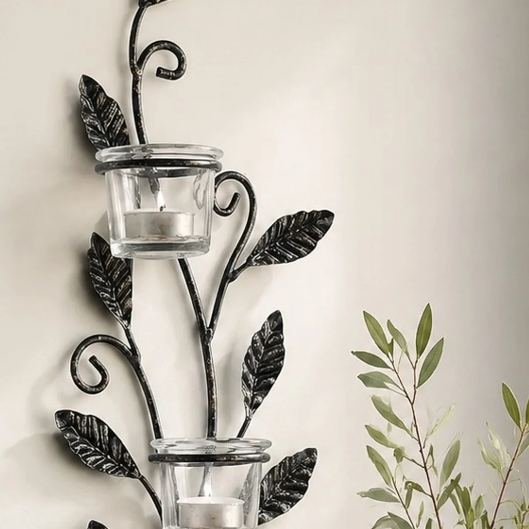 Close wall-use detail of Aura black iron candlestick