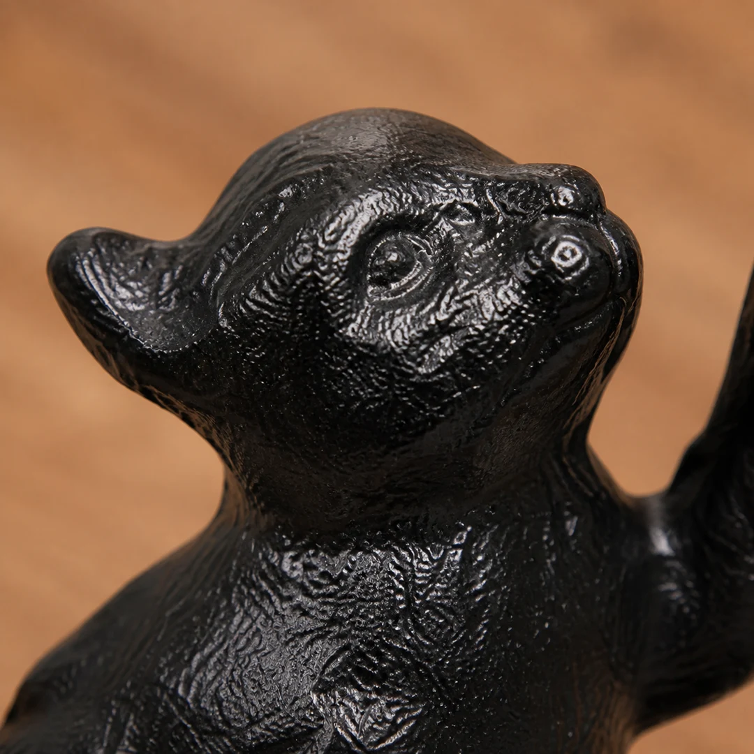 Cat head texture detail on Guardian cast iron door stopper