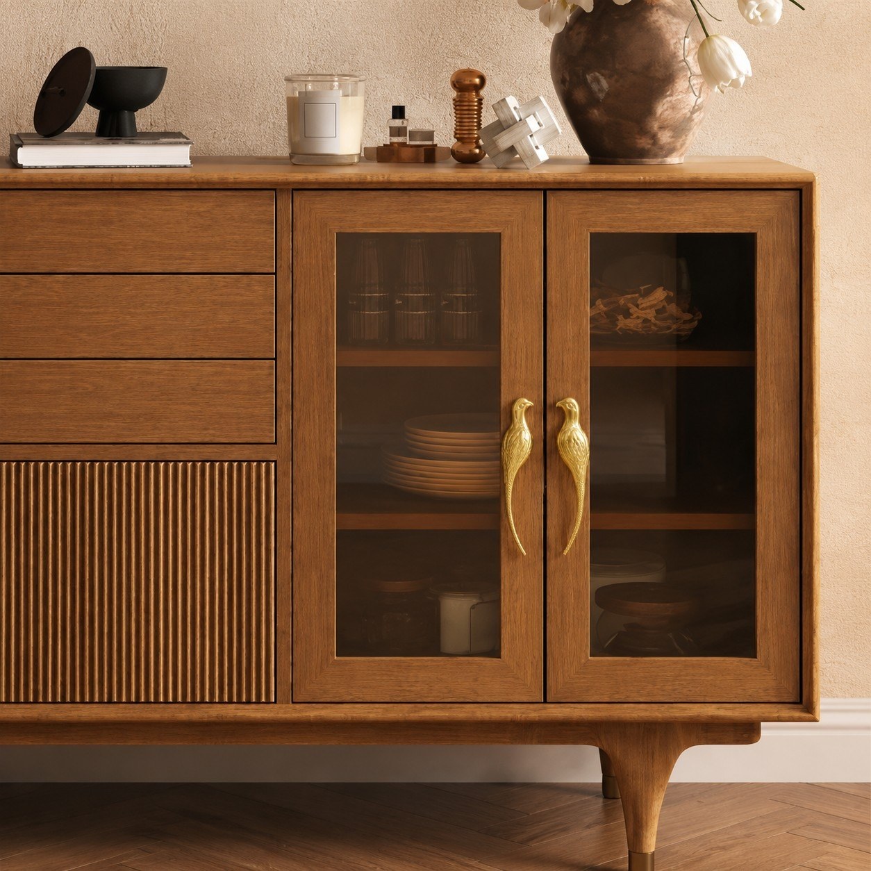 Totem brass handles installed as a pair on a wooden sideboard cabinet