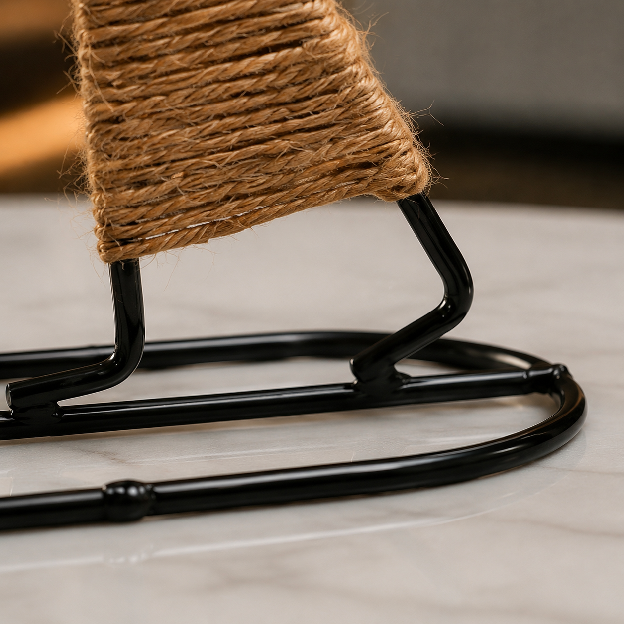 Close detail of Aura Handheld Lantern rope wrap and black metal base