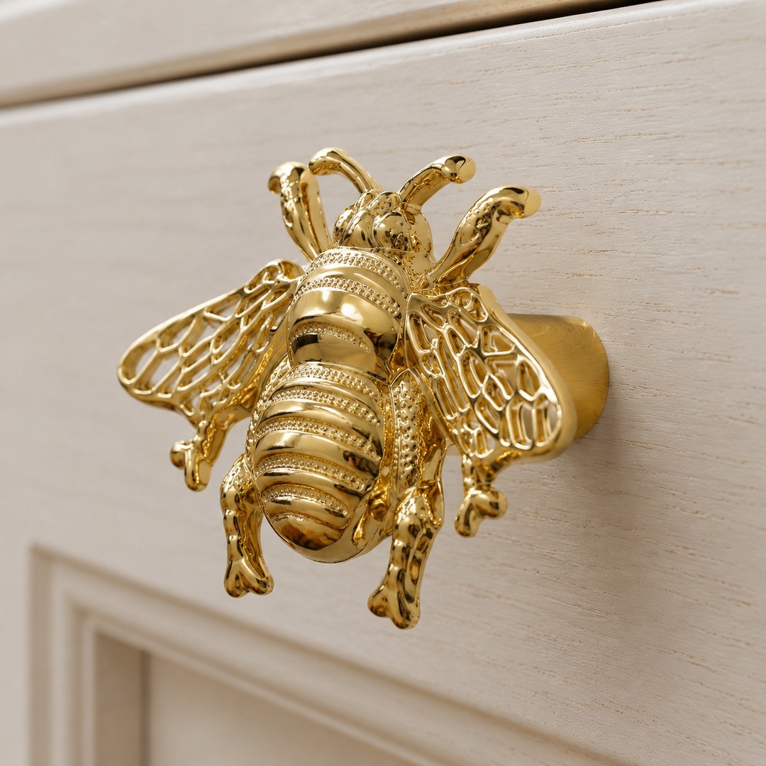 Gold cabinet handle side view showing mounting post projection