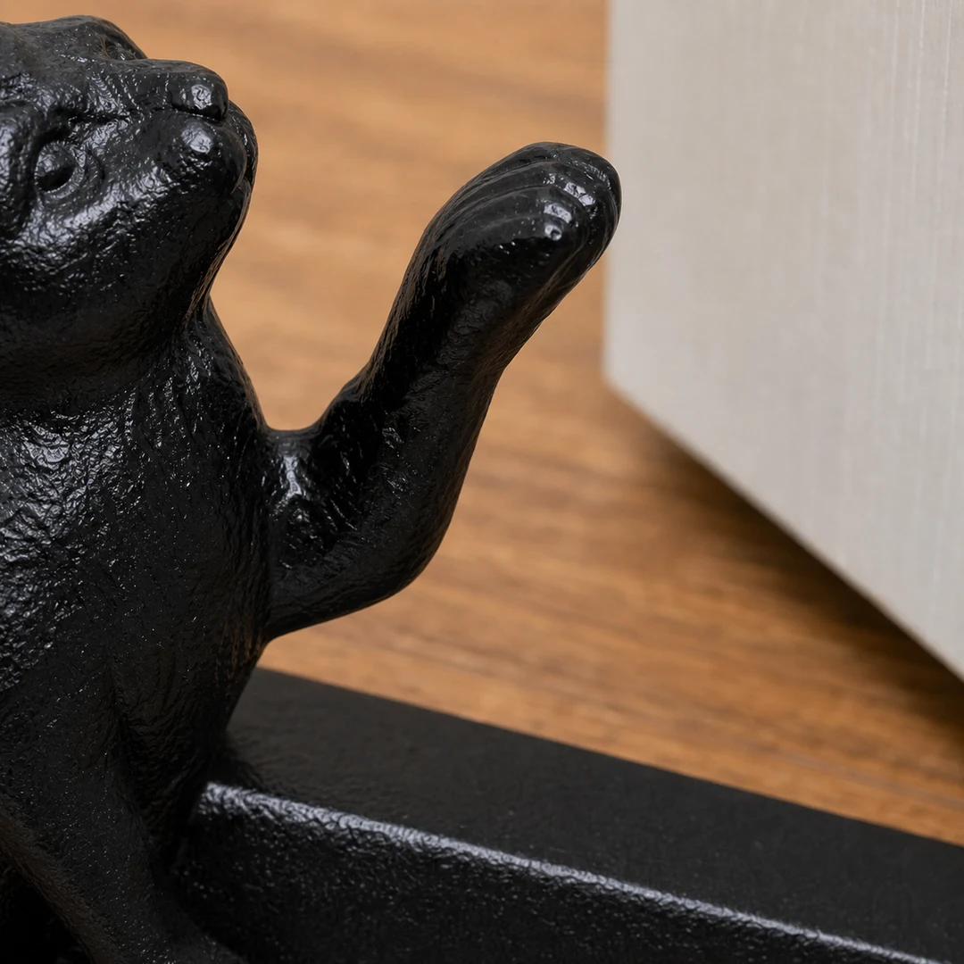 Raised paw detail on Guardian black cat door stopper