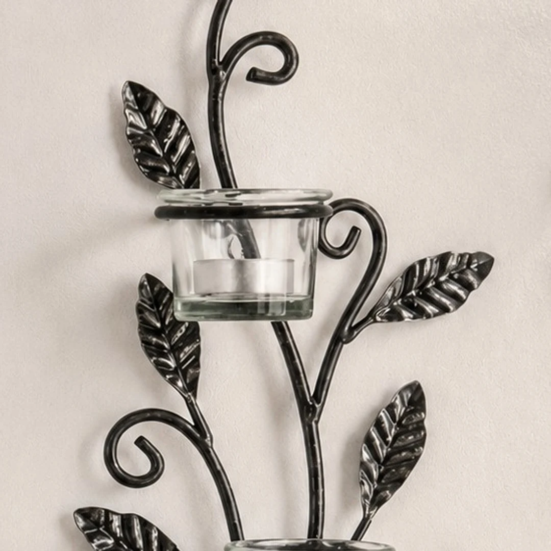 Close detail of Aura black iron wall candlestick silhouette