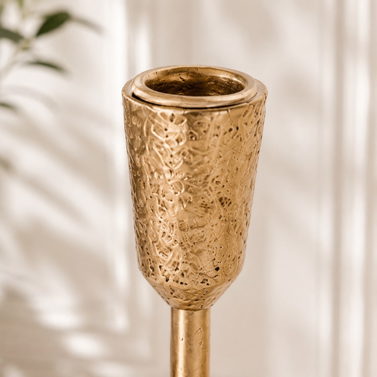 Textured candle cup and holder opening detail