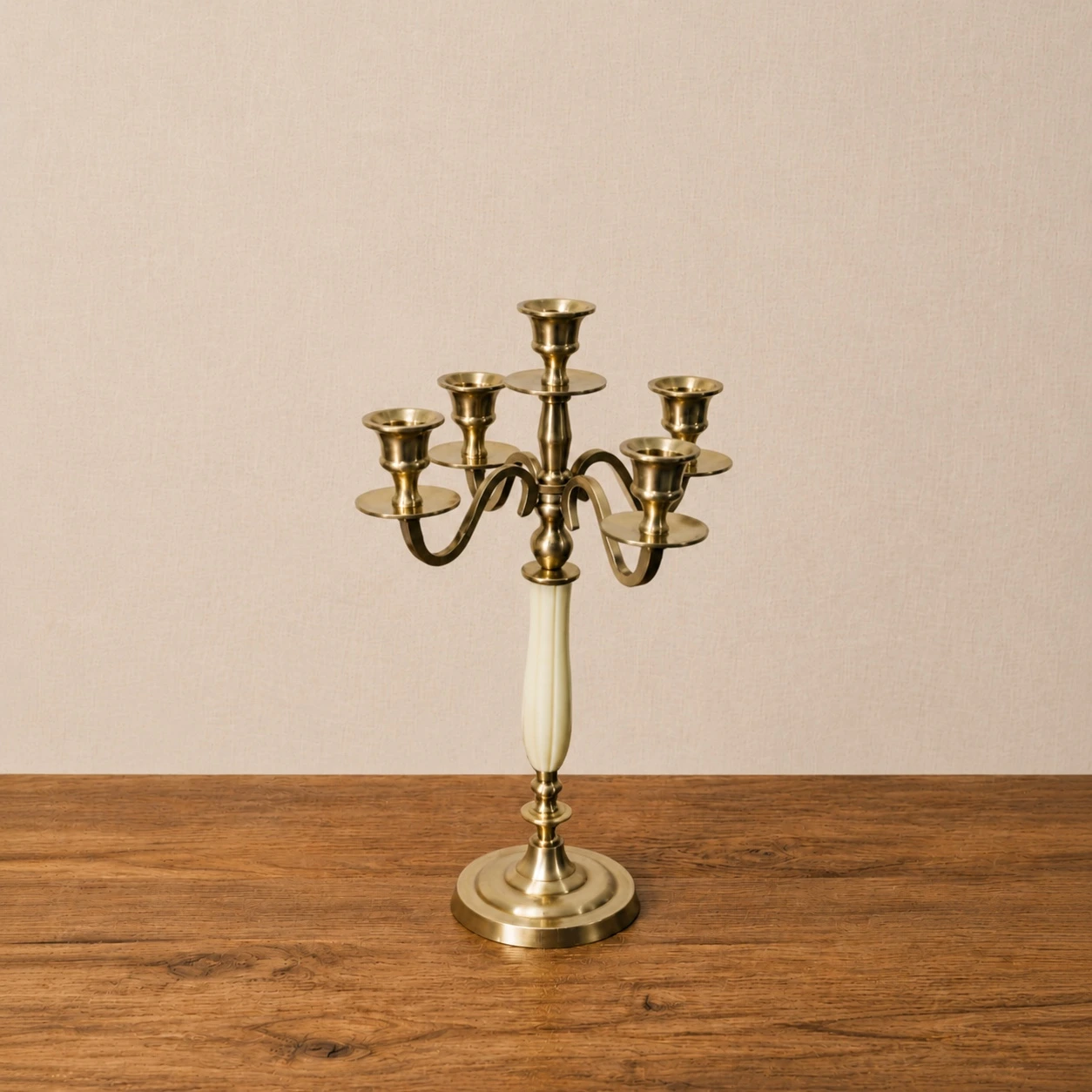 Aura five head copper candlestick holder on a warm neutral tabletop
