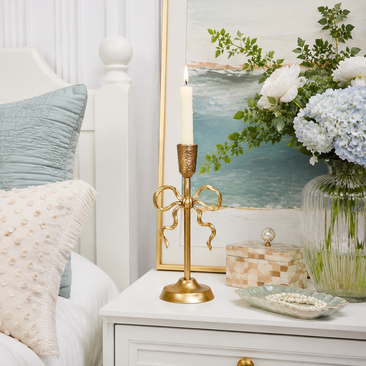 Aura gold candlestick holder on bedroom side table