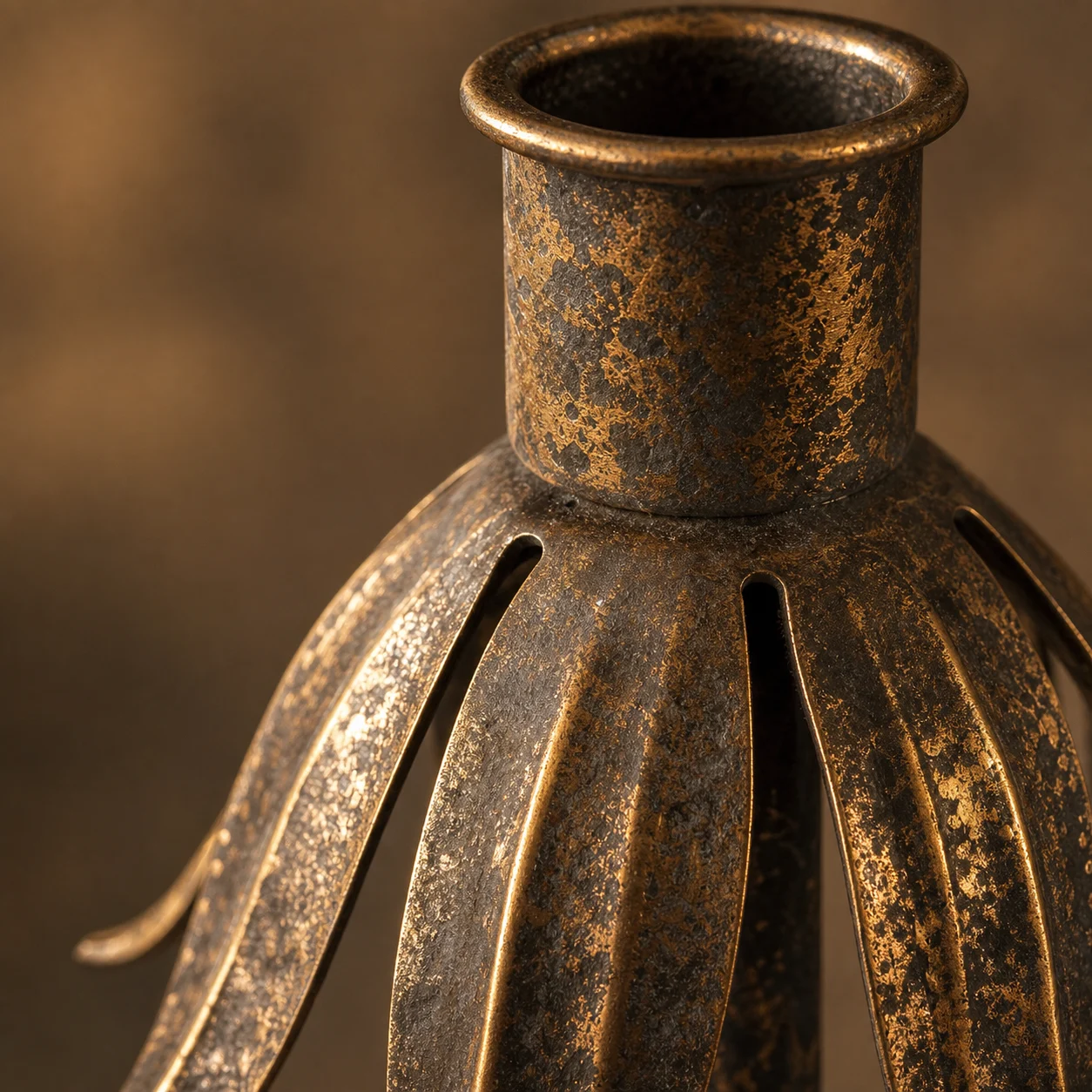 Close-up of antique dark bronze metal texture with gold highlights