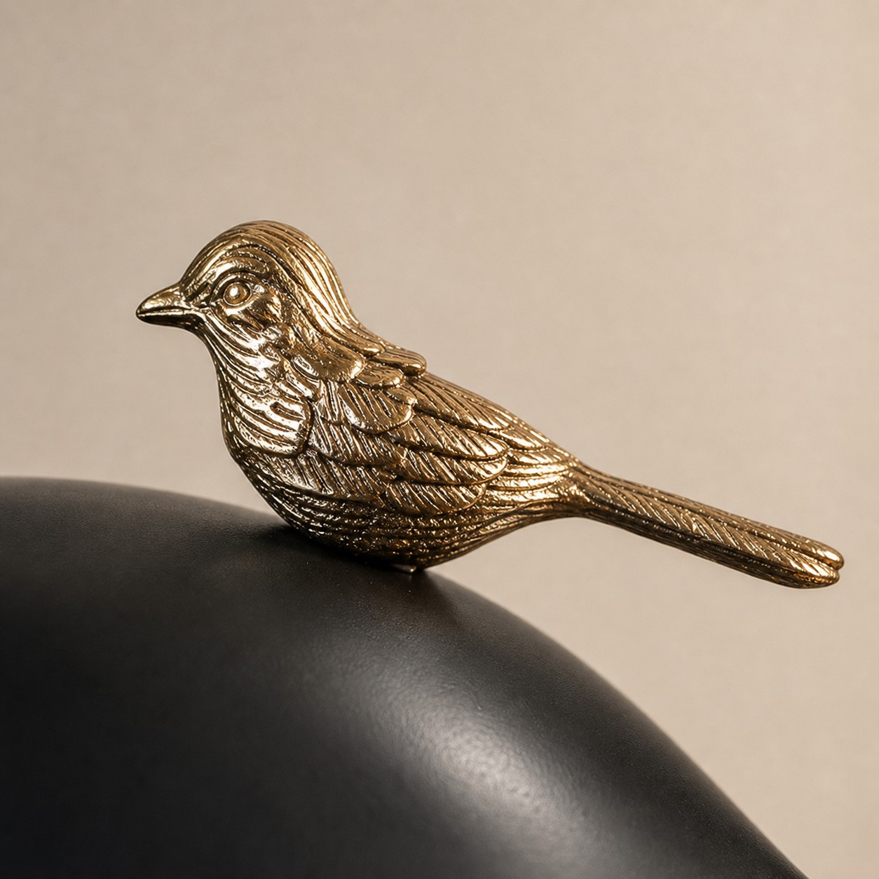 Equora copper-toned bird ornament detail
