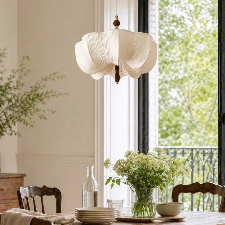 Lunelle white fabric pendant lamp beside a bright dining window