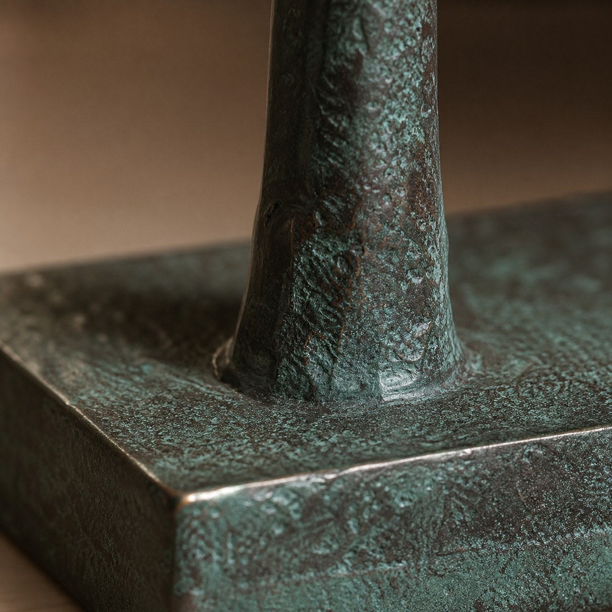Equora copper-patina resin sculpture base detail