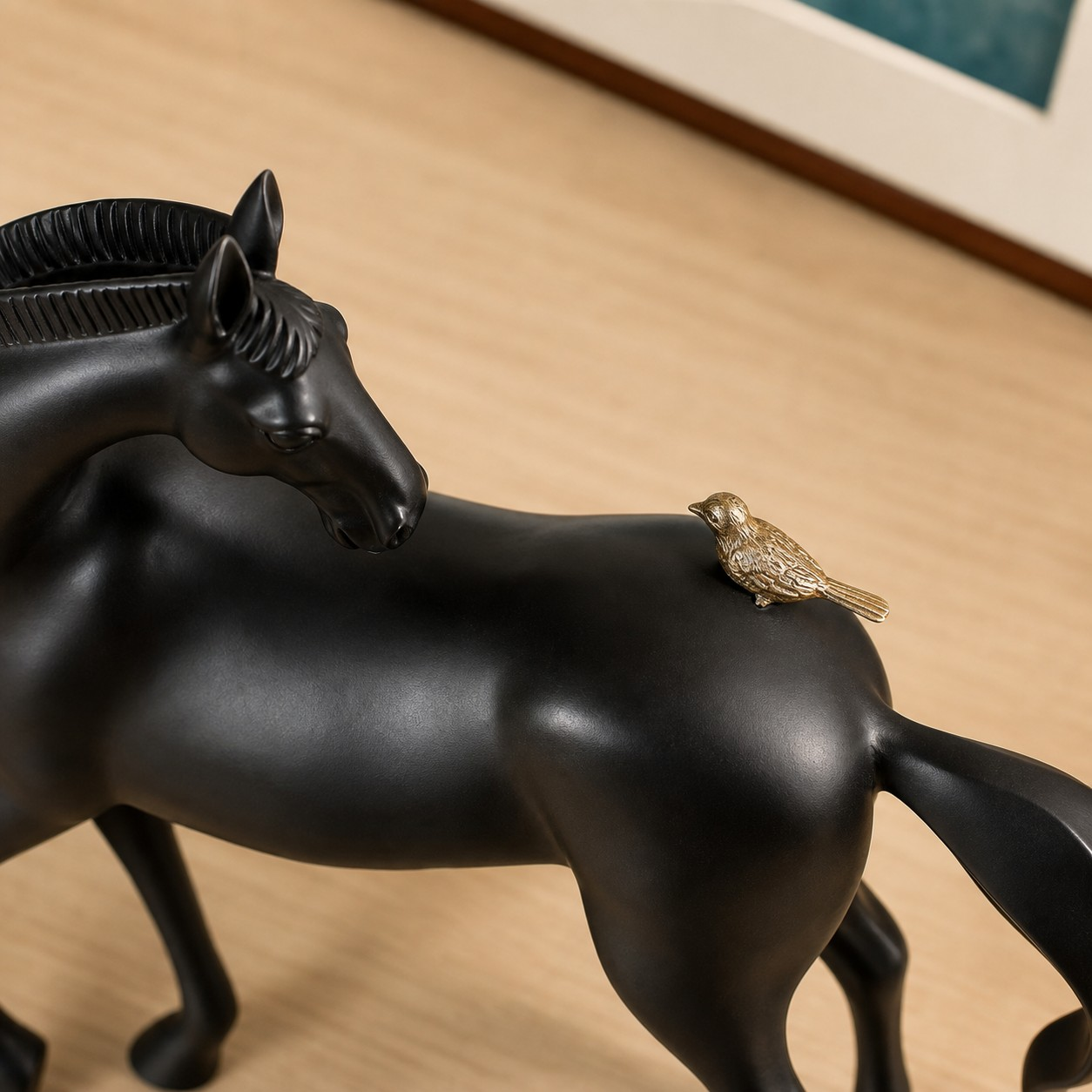 Equora black horse sculpture with copper bird detail
