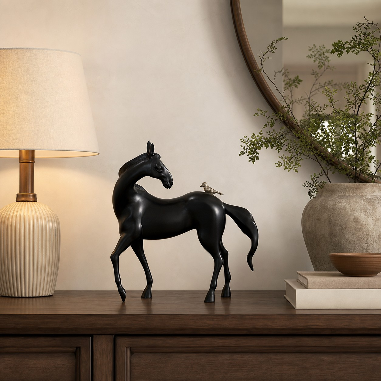 Equora horse sculpture styled beside a lamp and branches