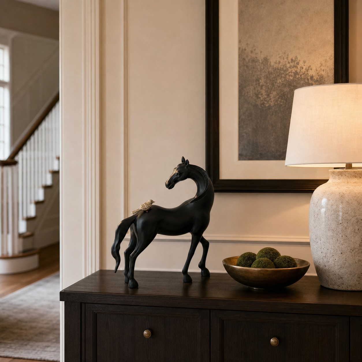 Equora black horse sculpture on a dark cabinet