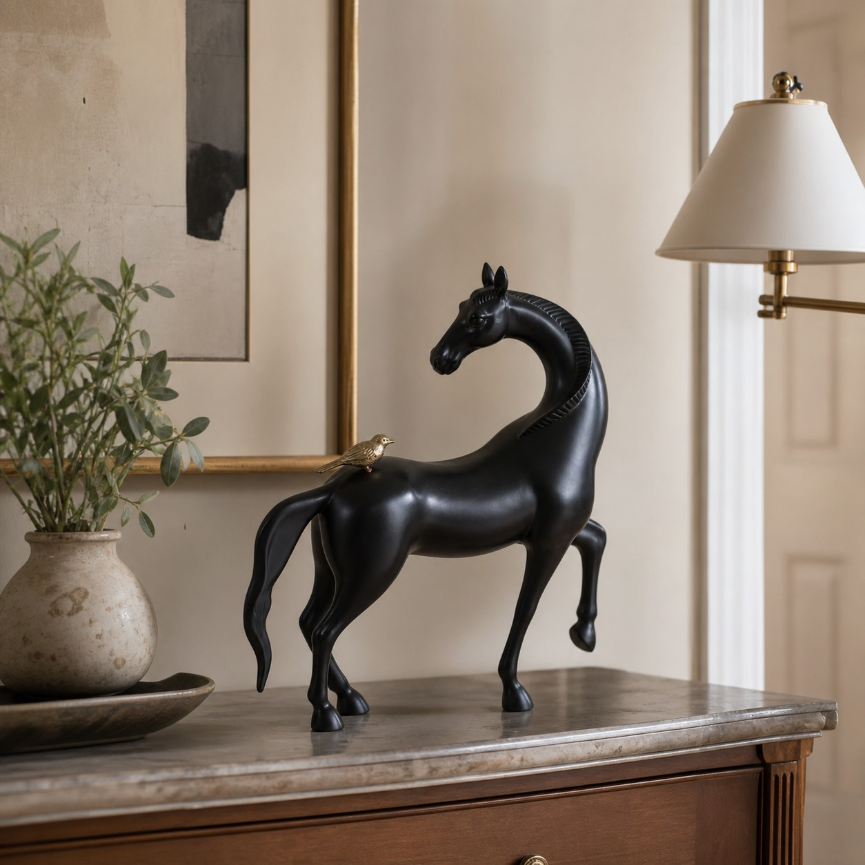 Equora black horse sculpture on a stone console