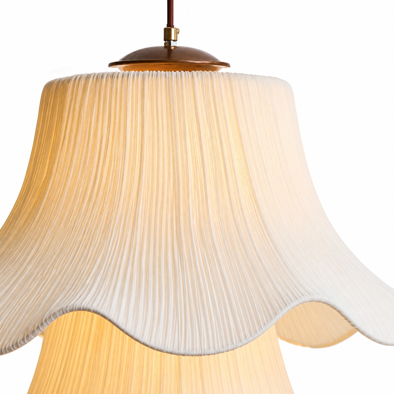 Close detail of Pluvia pleated fabric shade and wood top