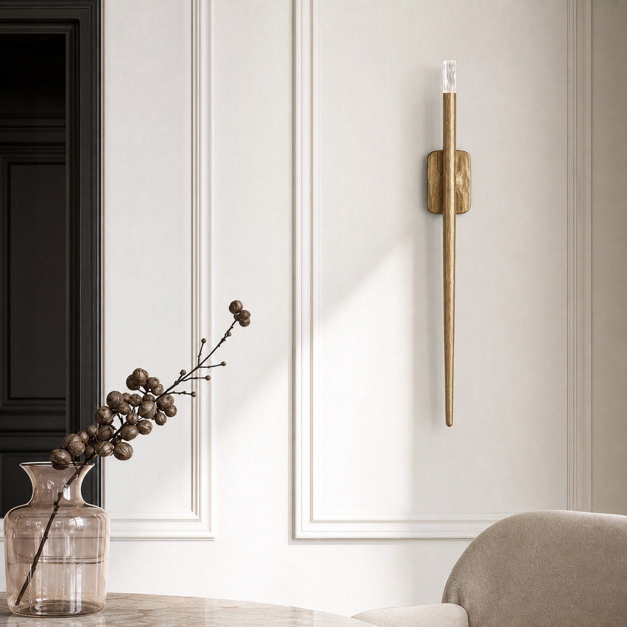 Large Linvero wall sconce beside a console and sofa