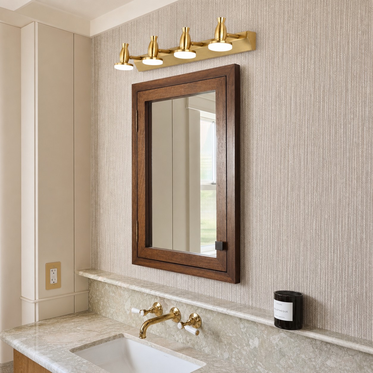 Bravio brass vanity light above a wood mirror bathroom vanity