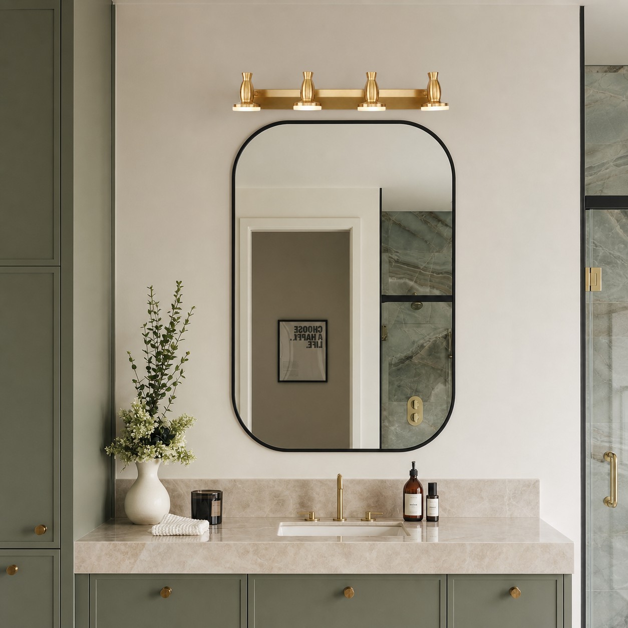 Bravio brass vanity light above a green cabinet bathroom mirror