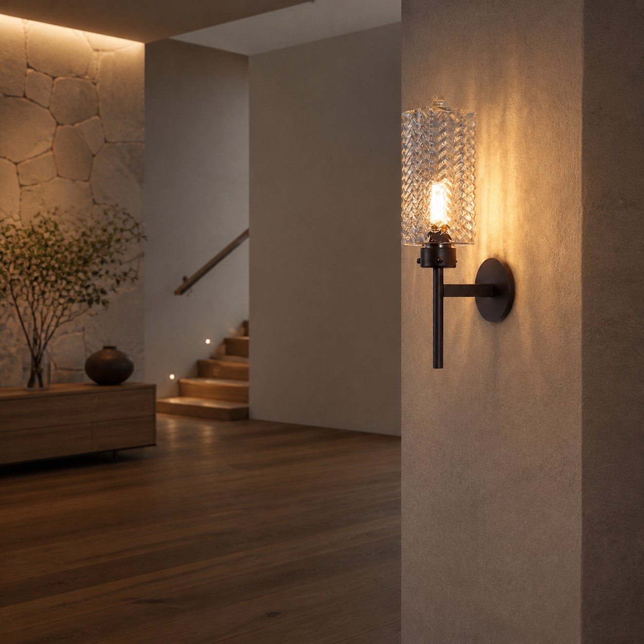 Outdoor wall sconce lit beside seating area