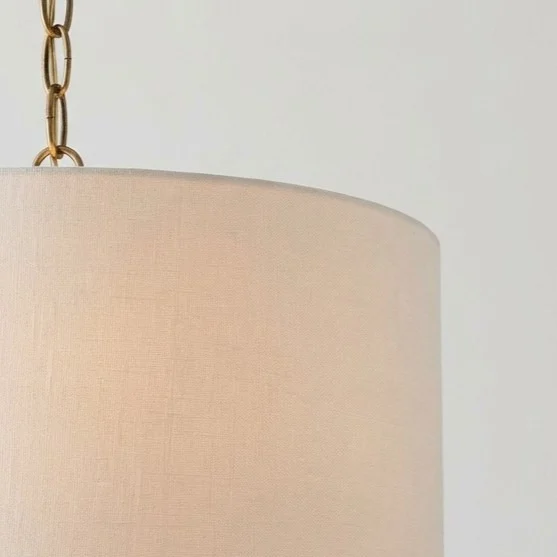 Brass chain joining the linen shade