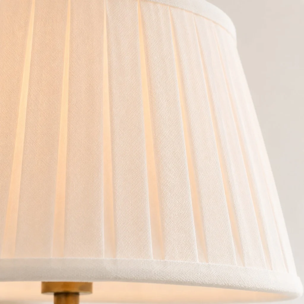 Pleated linen shade, lit