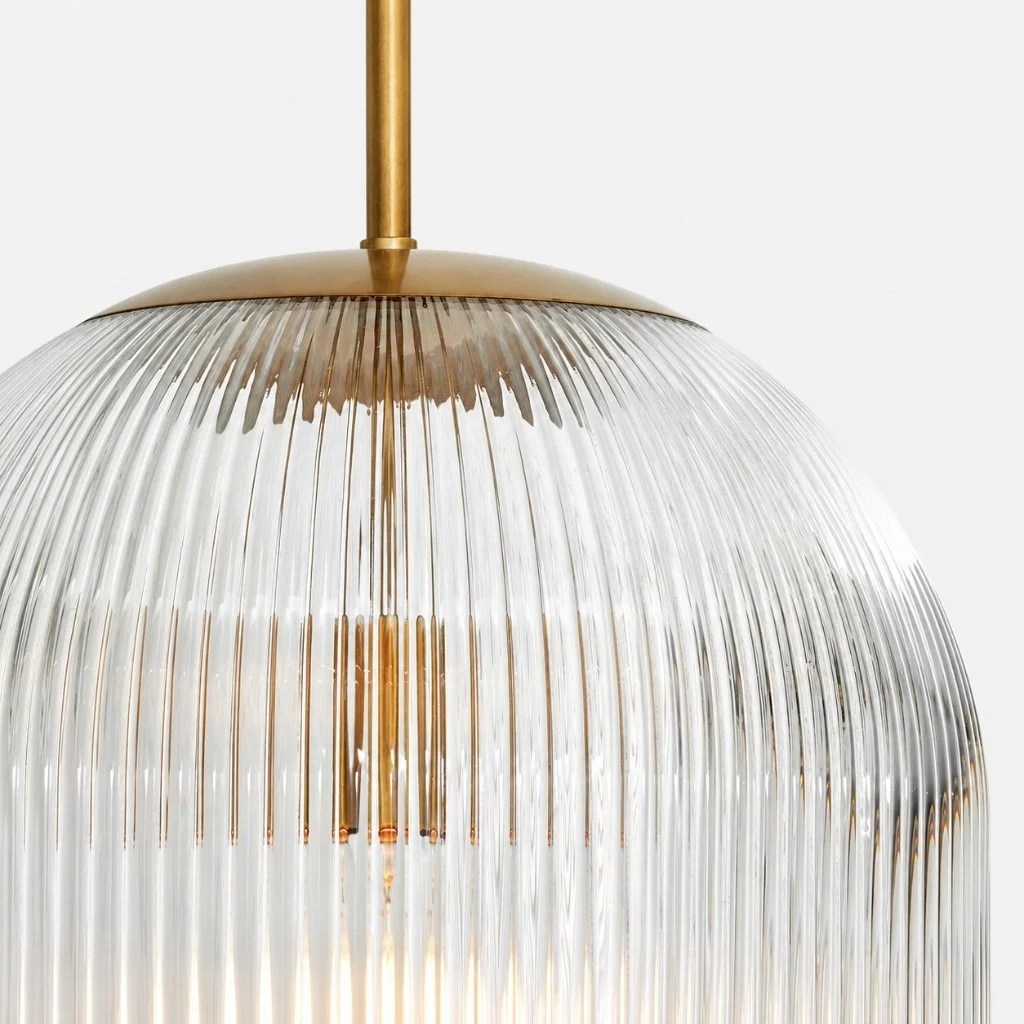 Ribbed glass shade and brass cap, lit