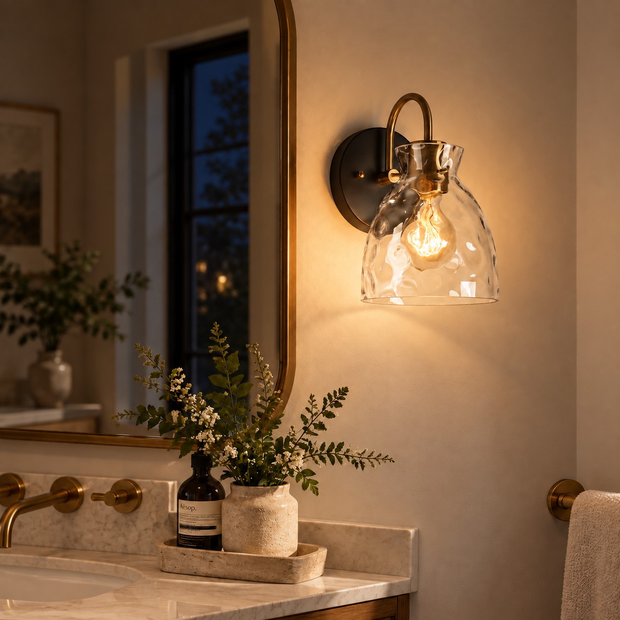 Textured Glass Wall Sconce with a clear shade and a visible bulb