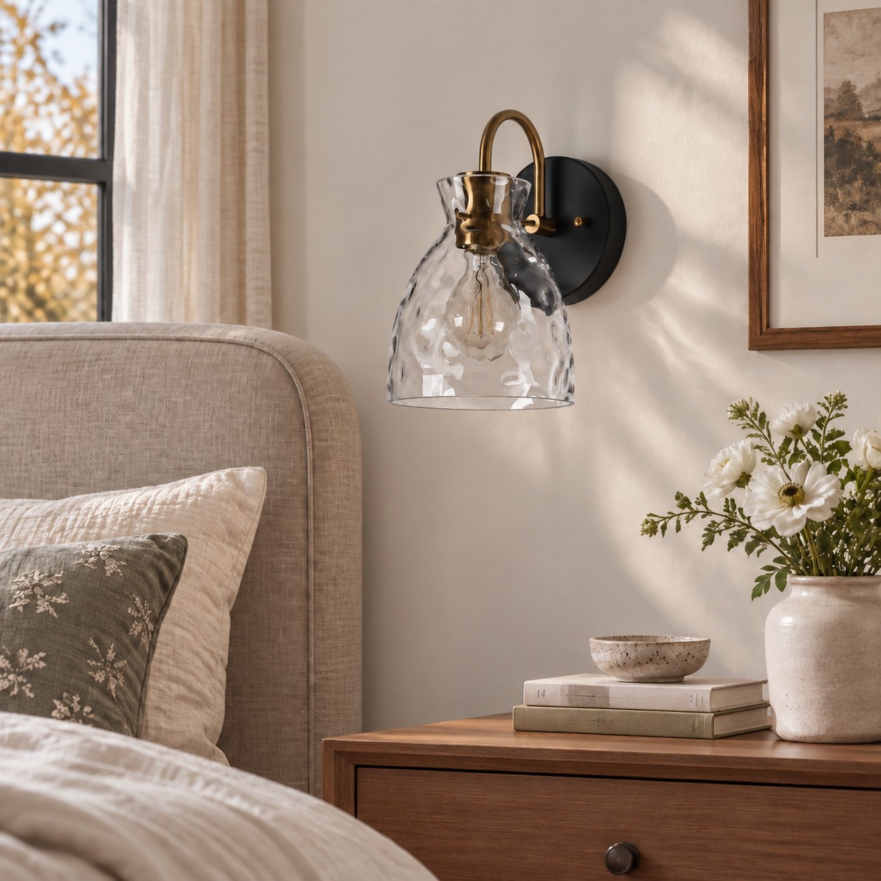 Textured Glass Wall Sconce with a clear shade and a visible bulb