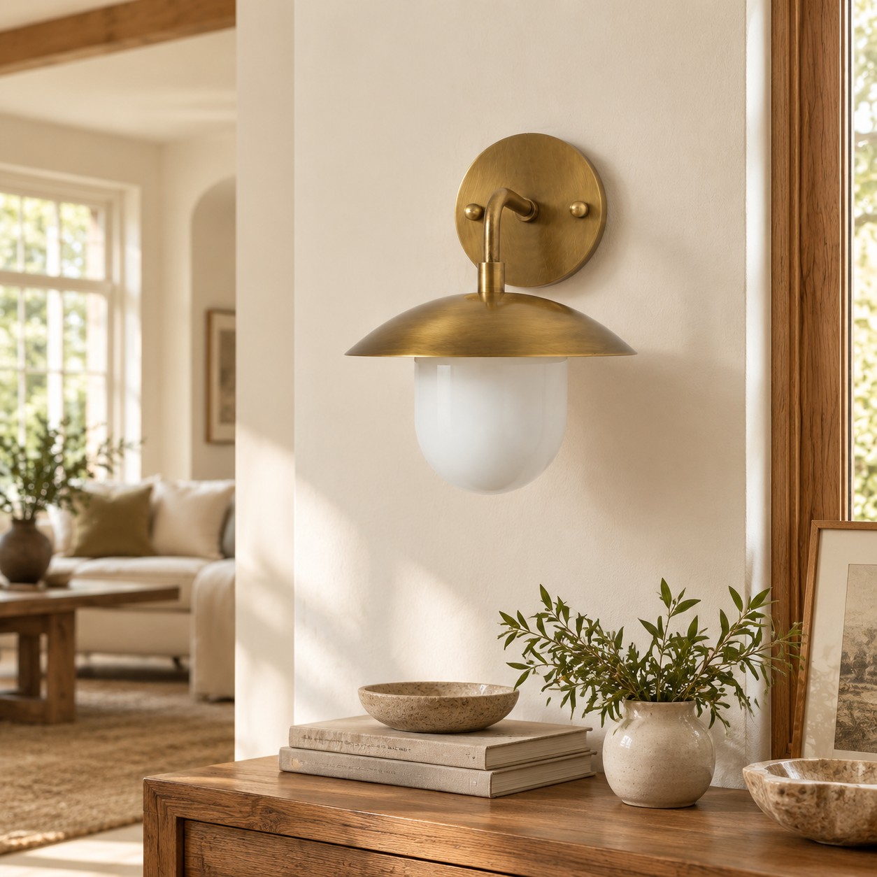 Sculptural Glass Wall Sconce with a brass finish and a metal wall mount