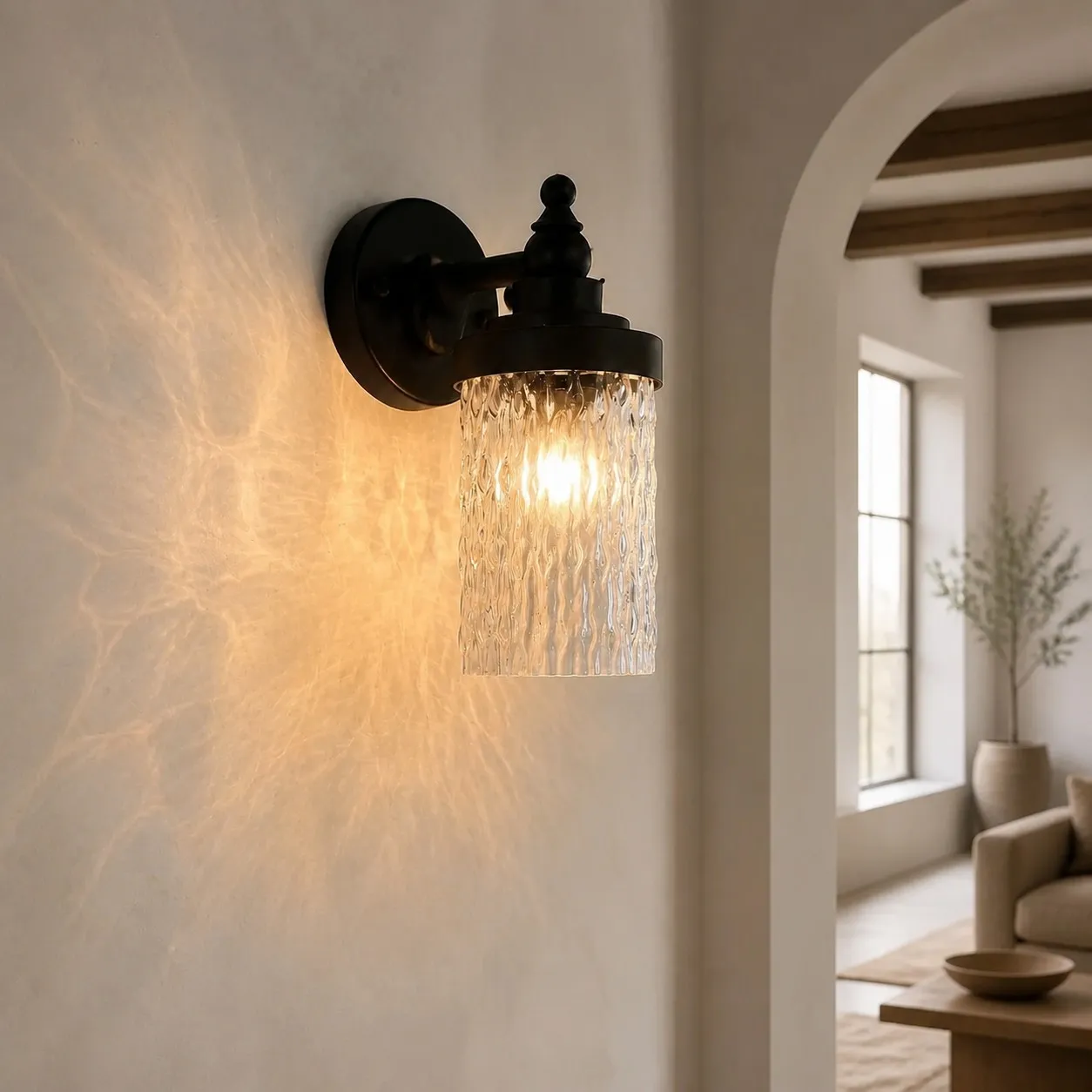 Wall sconce casting warm light in a hallway corner