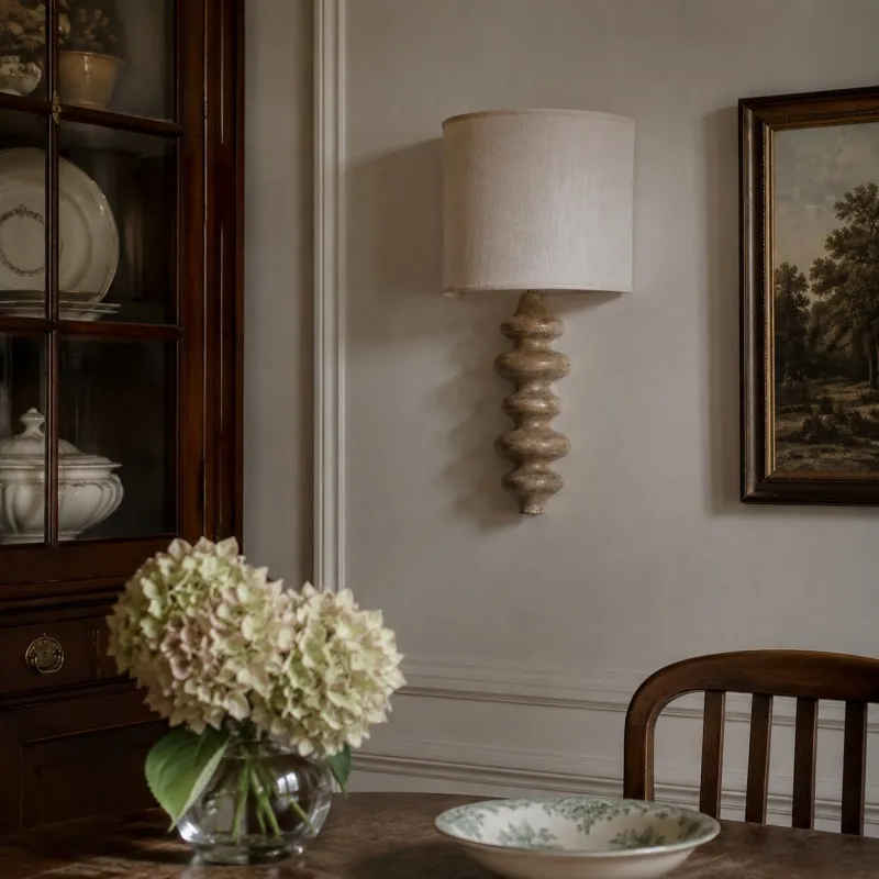 Natural wood wall lamp in a dining room setting