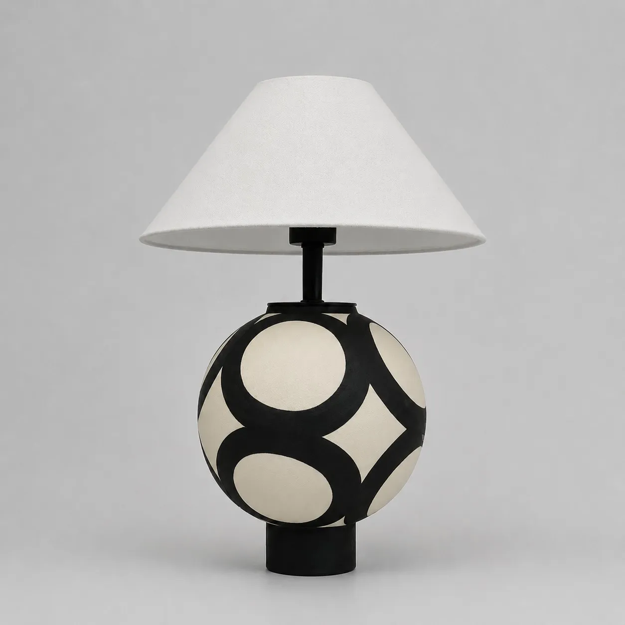 black and ivory ceramic globe table lamp with white fabric shade