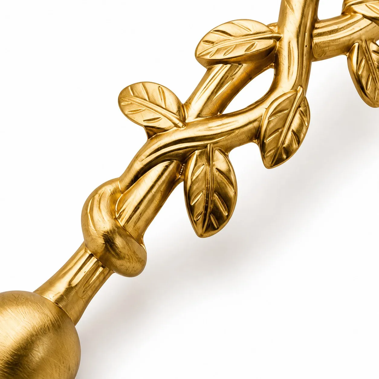 Brushed brass leaf detail on the cabinet pull