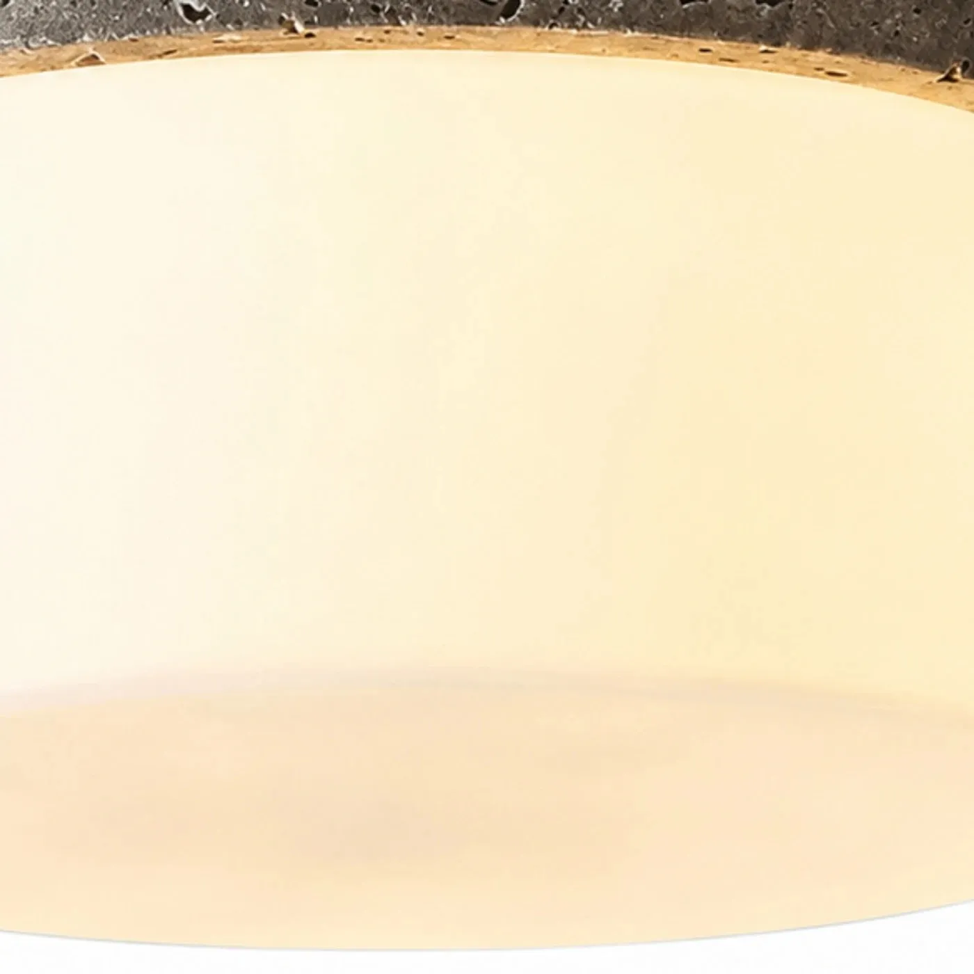 Close detail of warm glass shade and soft diffuser glow