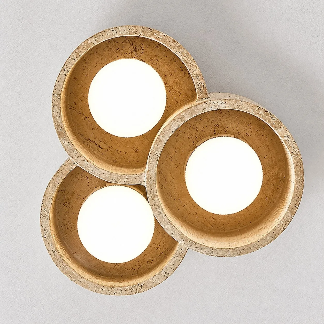 Bottom view of three round travertine light openings