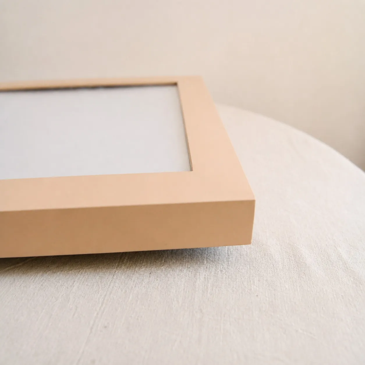 Cream square ceiling lamp corner and raised metal frame detail