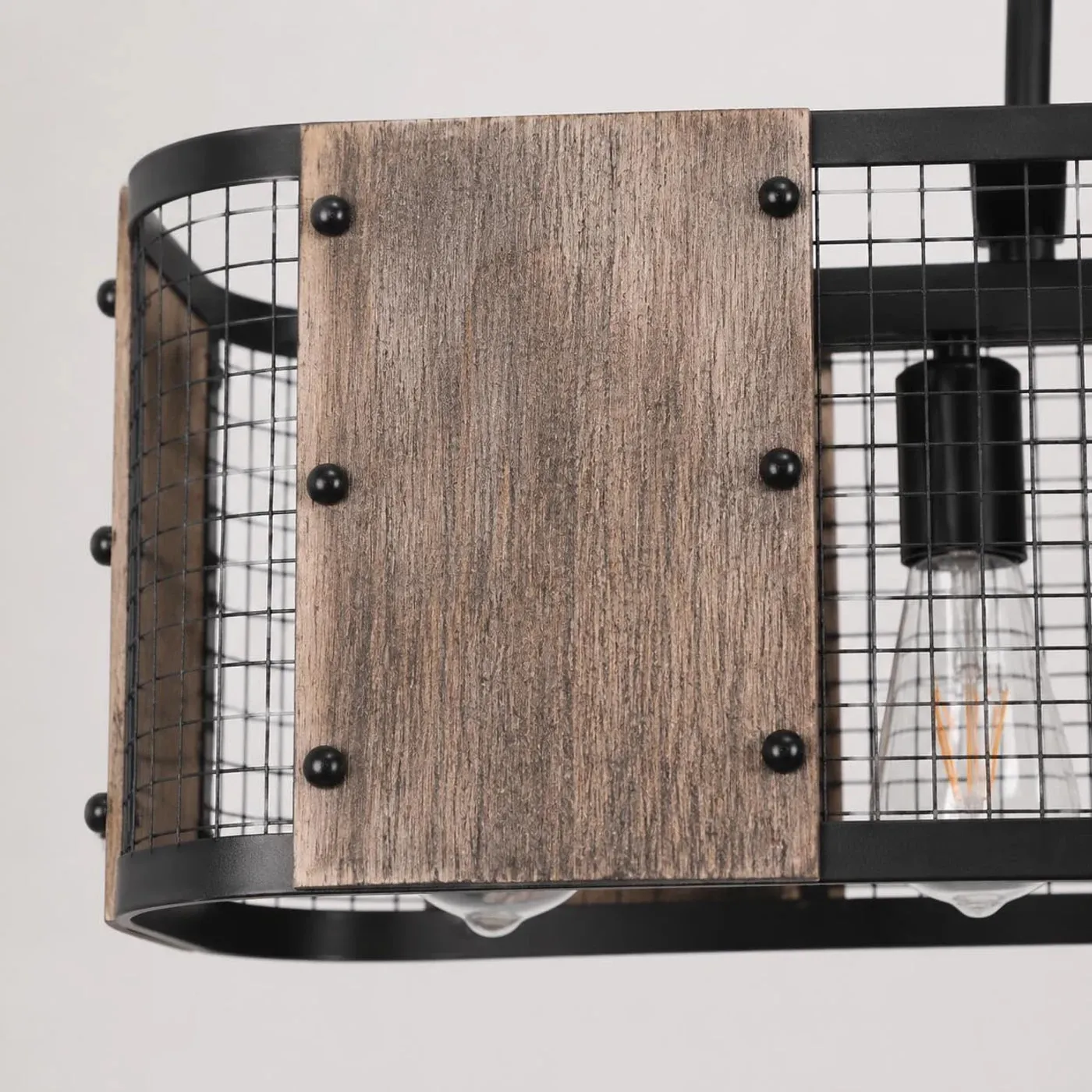 Close view of wood grain shade panel and black iron mesh