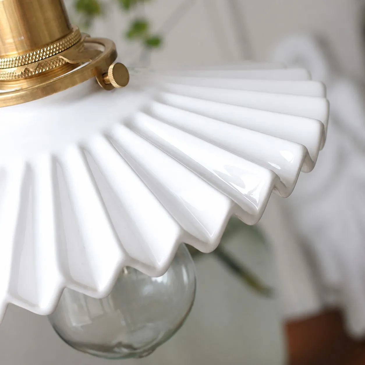 Close-up of glossy pleated ceramic shade