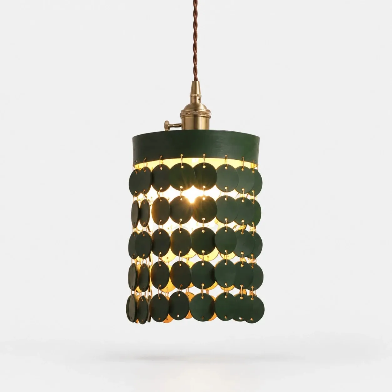 Green leather pendant light on a white background