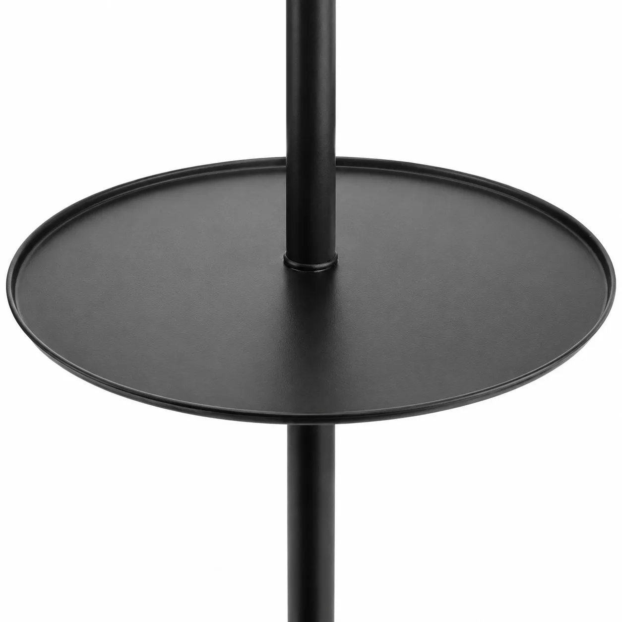 Close-up of the round black side table attached to the floor lamp stand