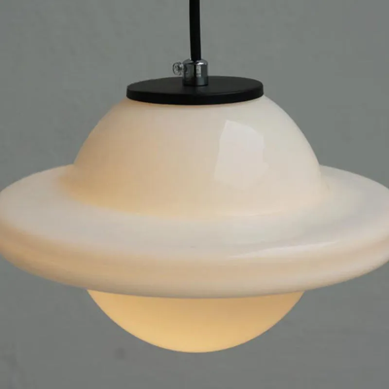 Milk glass shade and black canopy detail