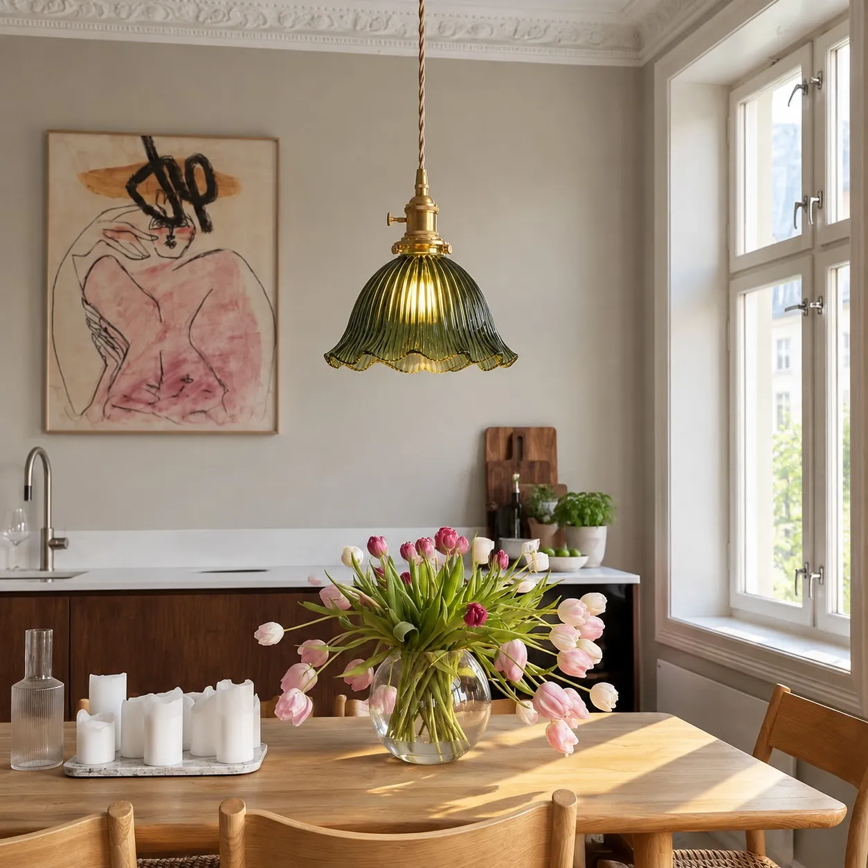 Blossix green glass pendant in a kitchen dining area
